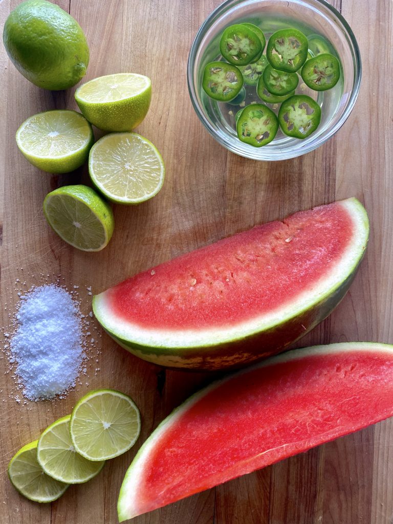 ingredients for margarita on a cutting board